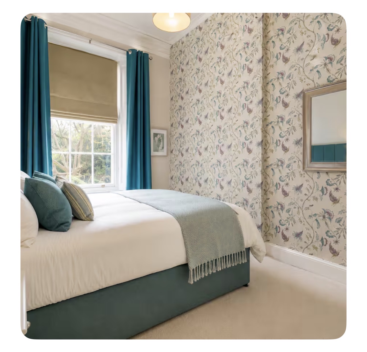 New Town Apartment 8 Bedroom with floral wallpaper and teal curtains - placeholder photo, not the actual New Town Apartment